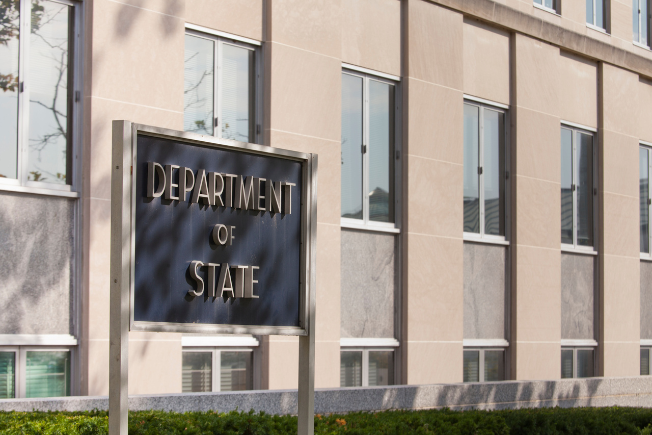 Department of State sign in front of a building Department of State sign in front of a building