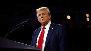 Donald Trump standing at a podium Donald Trump standing at a podium