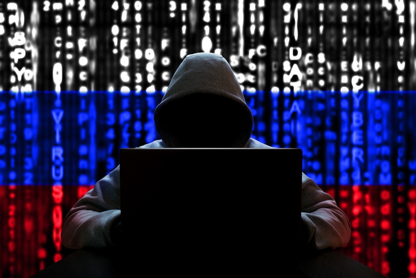 Russian hacker at a computer, on a background of binary code, the colors of the flag of Russia. 