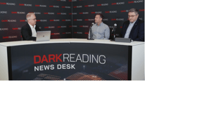 Two people talking at a news desk against a dark backdrop with "Dark Reading" written on it. Two people talking at a news desk against a dark backdrop with "Dark Reading" written on it.