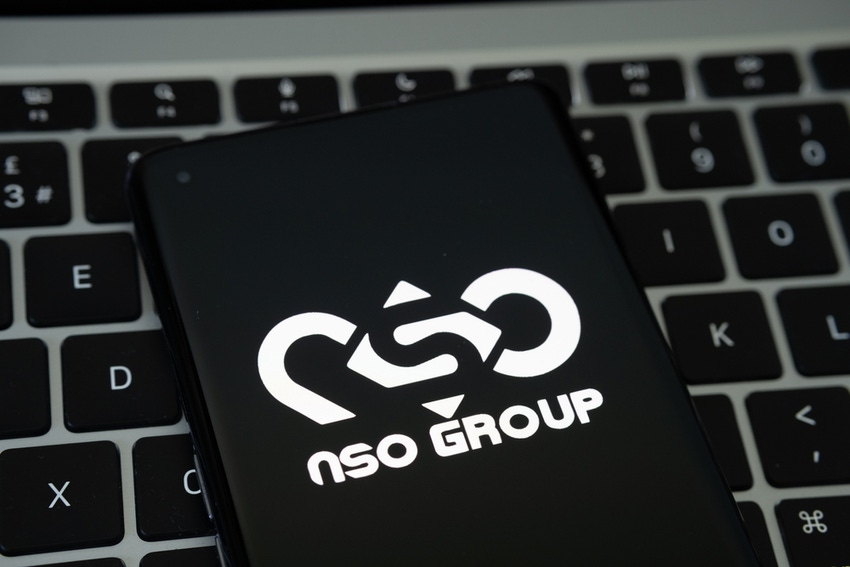 NSO Group logo seen on the smartphone placed on Apple Macbook laptop keyboard