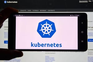 Kubernetes logo in blue on a white background on a mobile device screen 