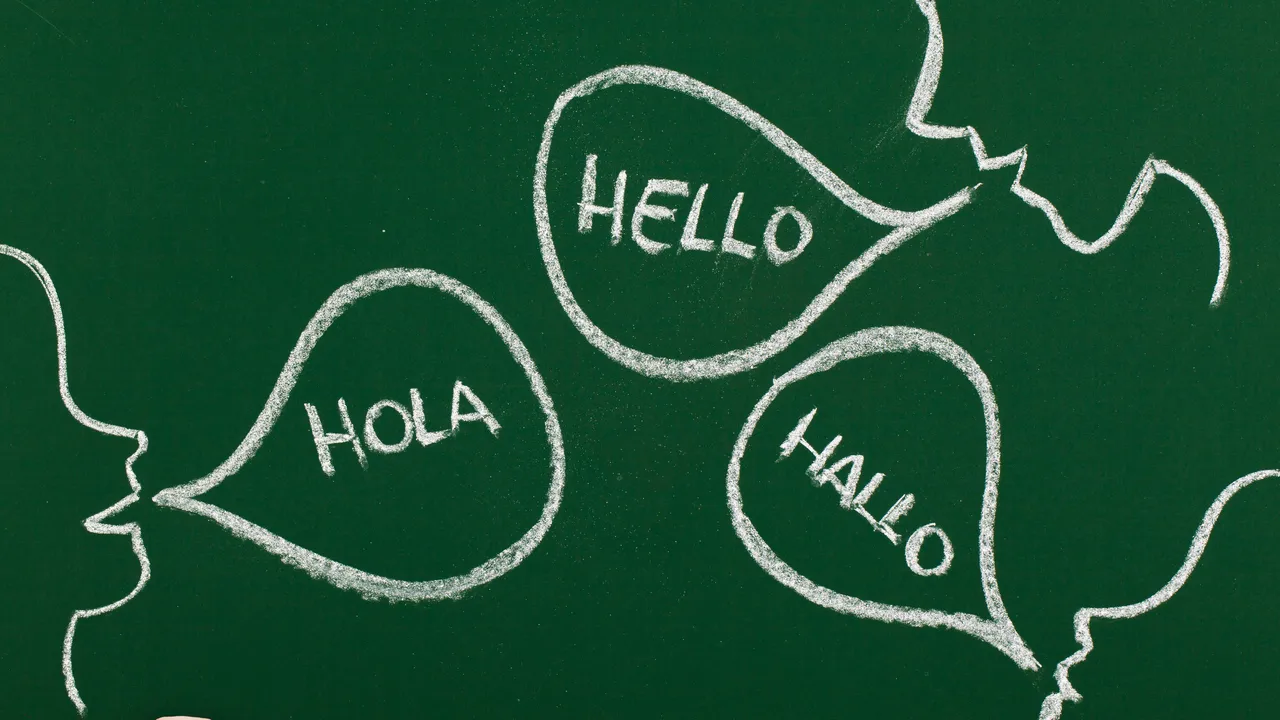 Three chalkboard drawings greet each other with "hello," "hola," and "hallo." Three chalkboard drawings greet each other with "hello," "hola," and "hallo."