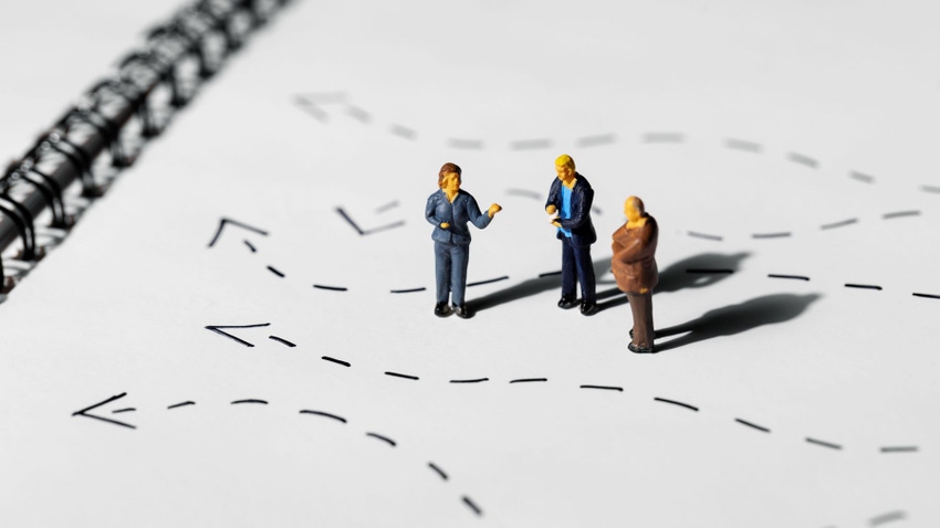 Businesspeople figures standing on strategy map