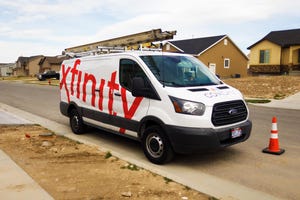 Photo of an Xfinity service van parked on a residential street