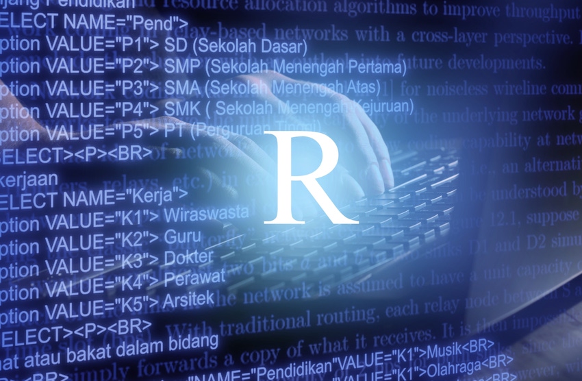 R programming language inscription against laptop keyboard and code background