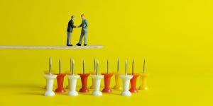 Illustration of two businessmen shaking hands while standing on a plank over a field of thumbtacks pointed up