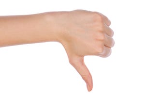 Female hand showing thumbs down failure hand sign gesture.