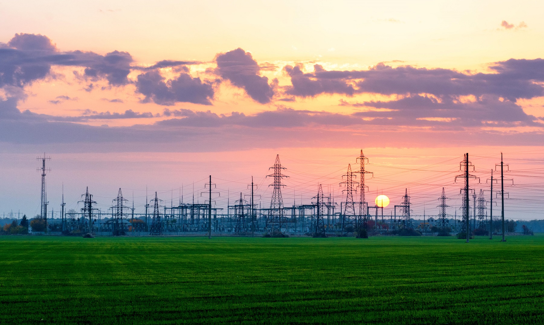 Sunset over an electric power substation