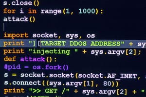 malicious code on a screen depicting a cyberattack