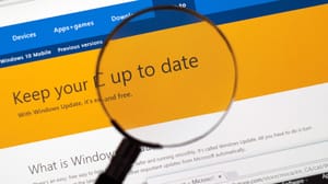 Magnifying glass over a Windows update notification Magnifying glass over a Windows update notification