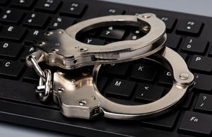 Handcuffs on a keyboard
