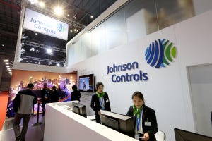 Two people at the front counter of a Johnson Controls establishment
