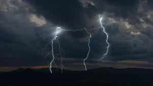 Lightning over a mountain range at night. Lightning over a mountain range at night.