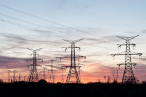 Photo of electrical transmission towers carrying high voltage lines.