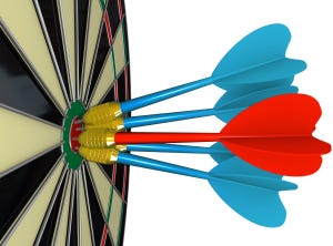 Five Darts Hit Bulls-Eye on Dart Board Competition. 4 darts are blue and one dart is red.