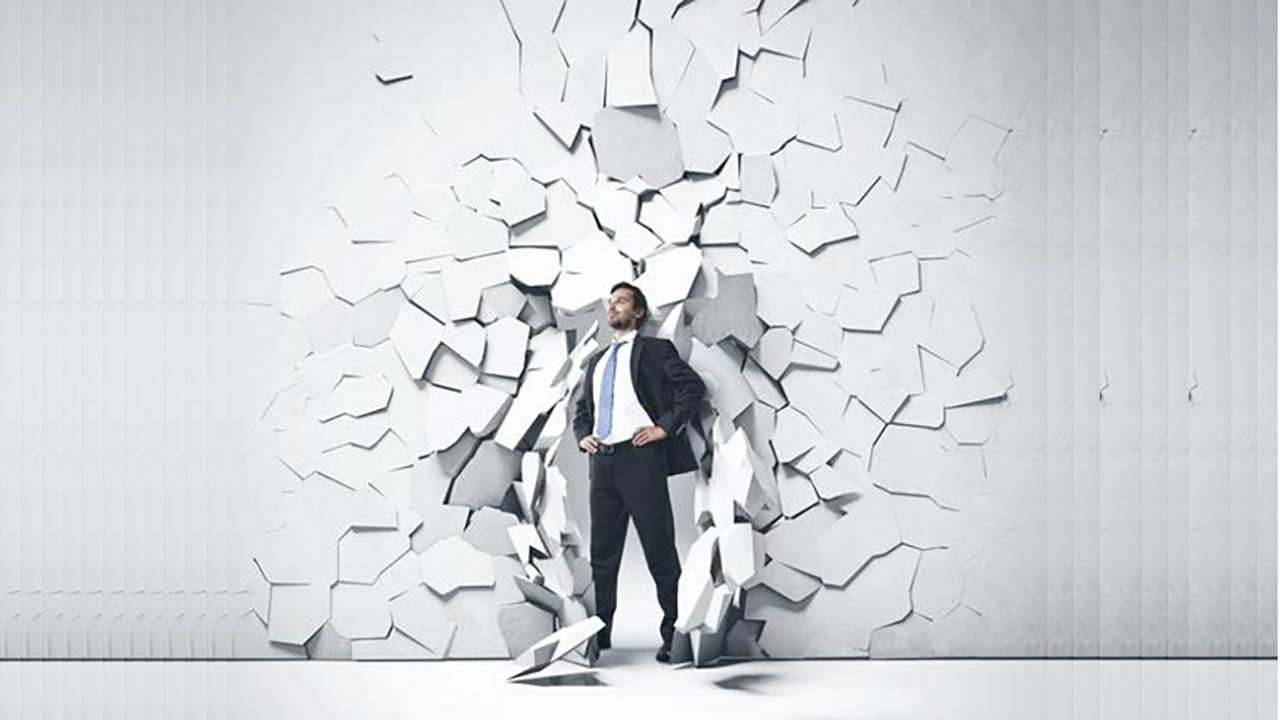 person in a dark suit and beard breaking out of a white wall person in a dark suit and beard breaking out of a white wall