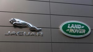 Jaguar Land Rover logos on a silver building Jaguar Land Rover logos on a silver building