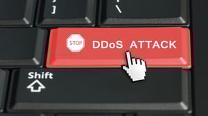 The words DDOS Attack on a red keyboard key The words DDOS Attack on a red keyboard key