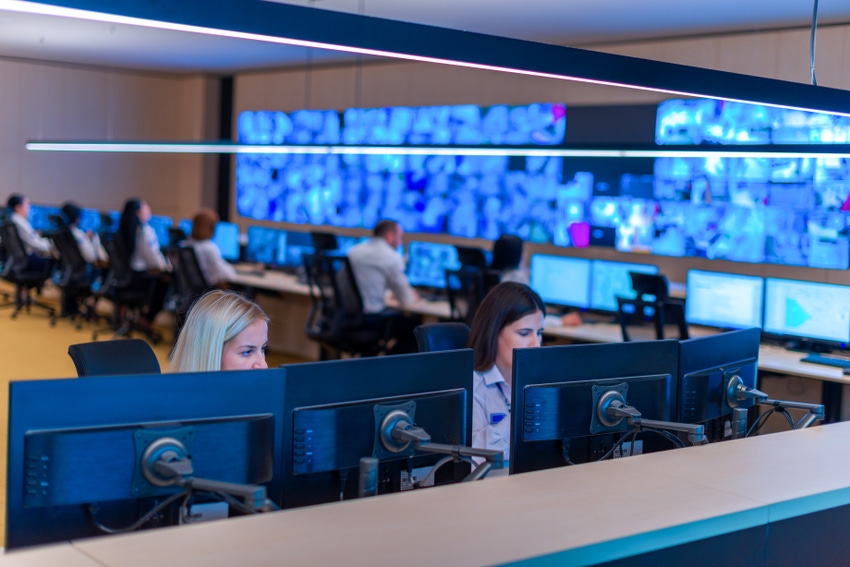 A Security Operations Center with analysts looking at screens to find security threats.
