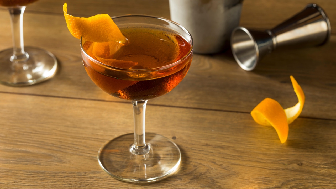 Alcoholic Martinez Cocktail with Gin Vermouth and Orange Peel Alcoholic Martinez Cocktail with Gin Vermouth and Orange Peel