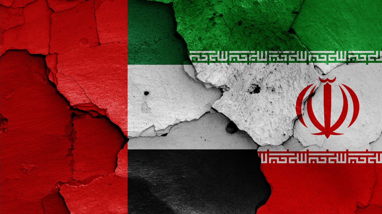 The UAE and Iranian flags, broken and crumbling The UAE and Iranian flags, broken and crumbling