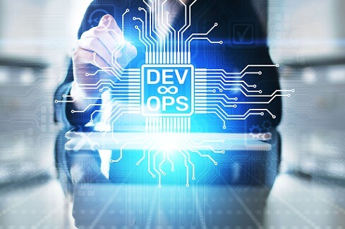 Photo of a businessperson tracing illustrated virtual circuits on an implied screen labeled "DevOps"