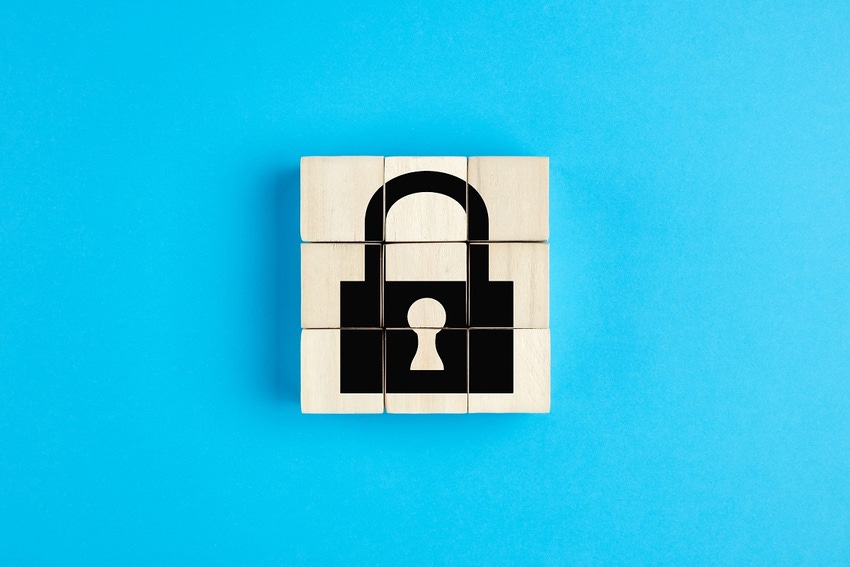 Picture of a lock on wooden blocks, with blue background