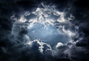 Light seen through dramatic dark clouds