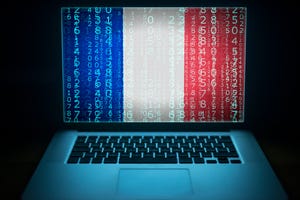 Laptop with French flag, code and digits on the screen. 