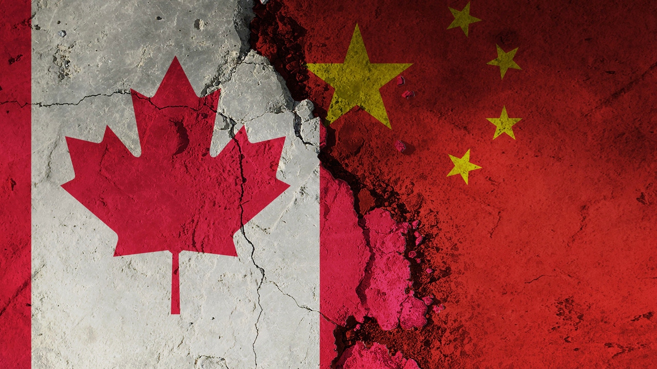 Canada vs china flag on a rough, broken, and cracked background Canada vs china flag on a rough, broken, and cracked background