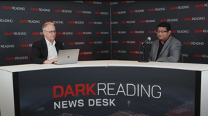 Two people talking at a news desk against a dark backdrop with "Dark Reading" written on it. Two people talking at a news desk against a dark backdrop with "Dark Reading" written on it.