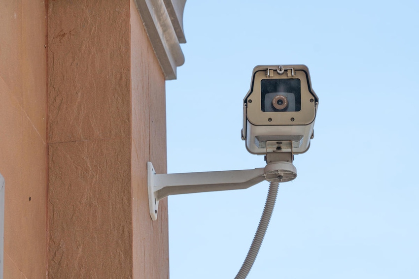 A security camera attached to a building wall