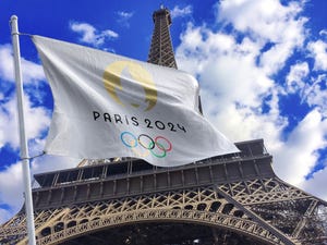 Flag of French Olympics Games 2024 with Eiffel Tower in the background