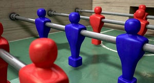 Red and blue players on a foosball table