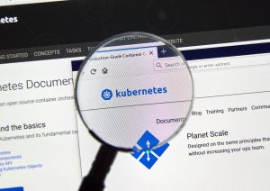 Image contains screenshot on a computer with magnifying glass over the word "Kubernetes"