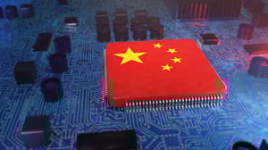 A microchip in the shape of the Chinese flag surrounded by a device's internal hardware A microchip in the shape of the Chinese flag surrounded by a device's internal hardware