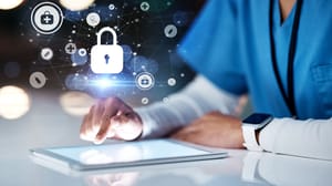 A person in medical scrubs working on a tablet computer A person in medical scrubs working on a tablet computer