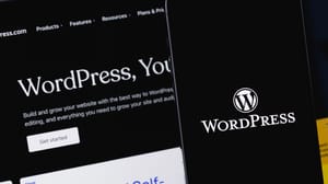 WordPress logo on mobile app and on the screen of a smartphone. WordPress logo on mobile app and on the screen of a smartphone.