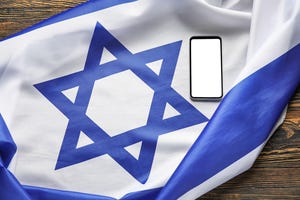 The Israeli flag next to a smartphone