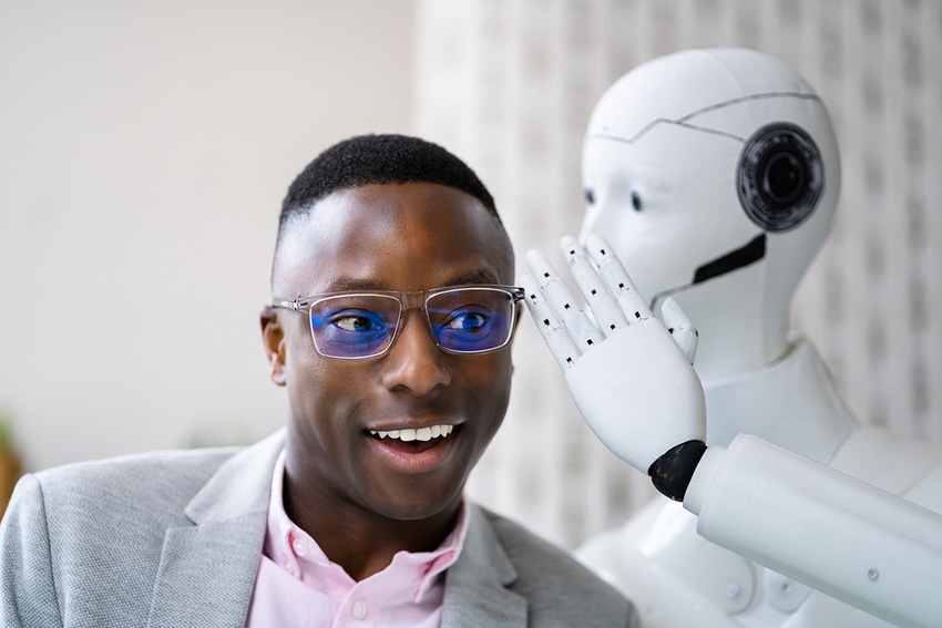 A young businessman wearing glasses grins as a robot leans in and whispers a secret into his ear