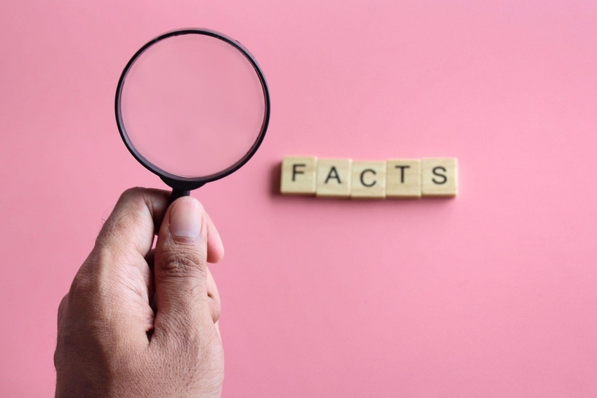 Magnifying glass and the word "FACTS"