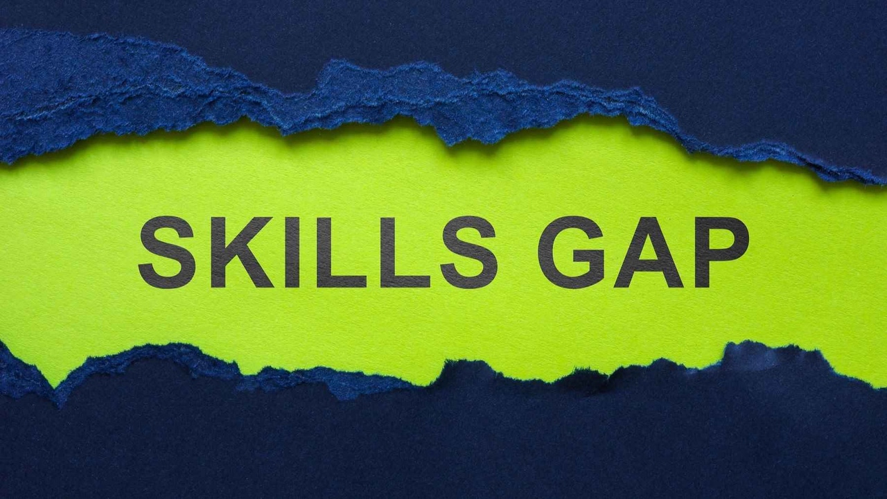 The words "skills gap" in a green cloud against a dark background. The words "skills gap" in a green cloud against a dark background.