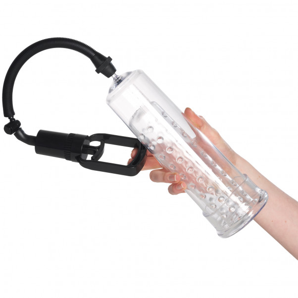 Hand holding a penis pump with masturbation sleeve