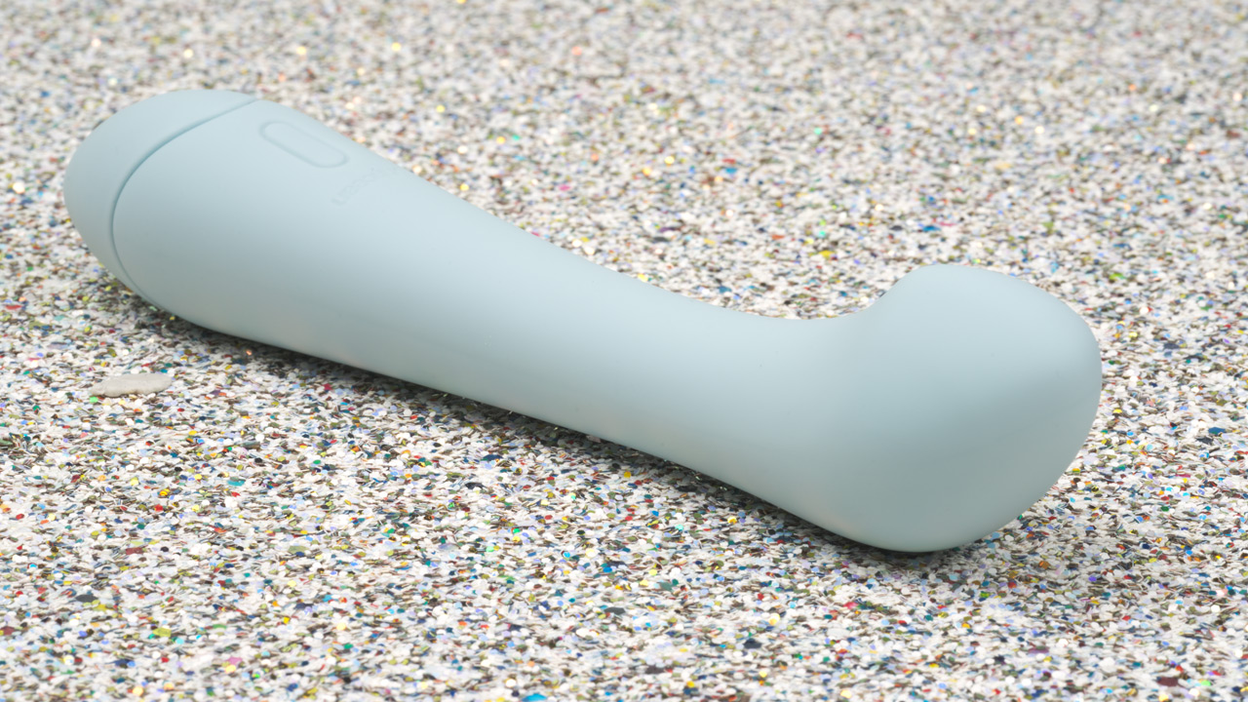 light blue G-spot vibrator on glitter background