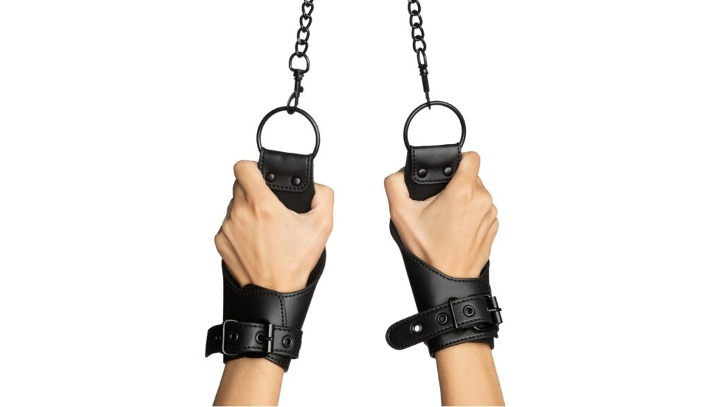 Hands hanging in handcuffs 