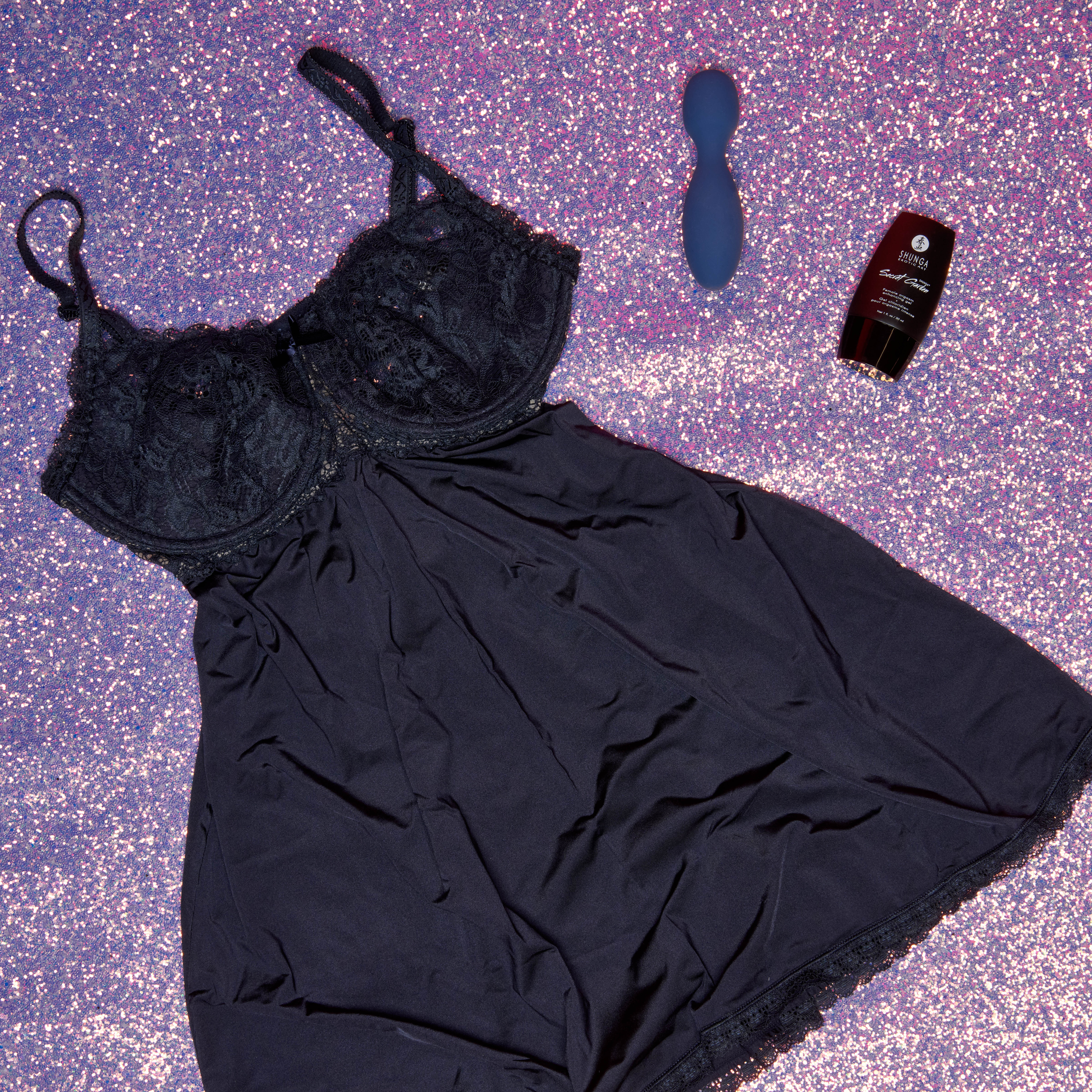 blue chemise with a wand vibrator and a gel. 