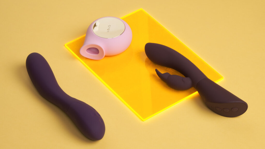 Sex toys for women on a yellow sheet