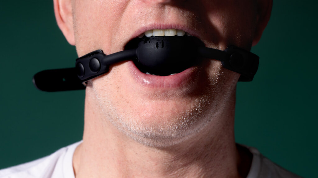 Man with gag ball in his mouth