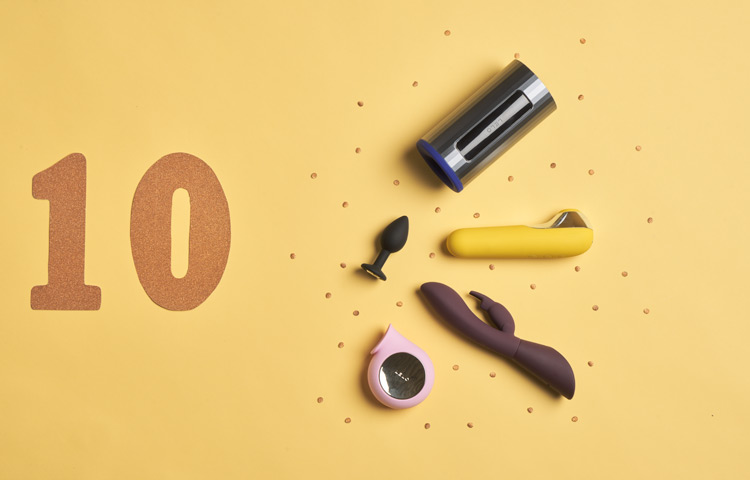 The number 10 and five pieces of sex toys on a yellow background